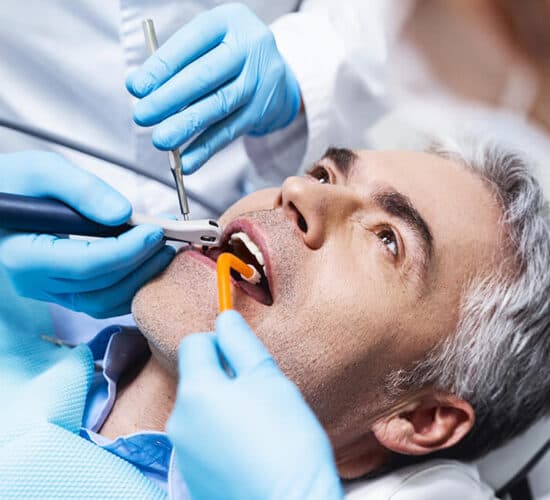 Dentist carrying out root canal treatment